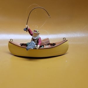 Santa fishing in canoe ornament